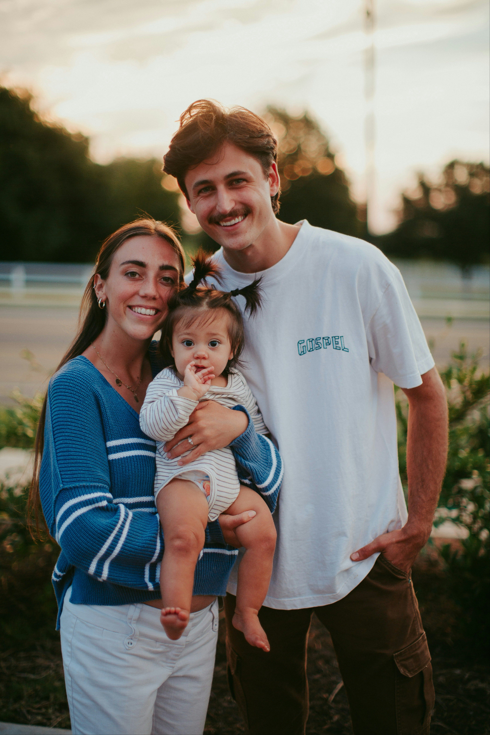 A young family together at golden hour